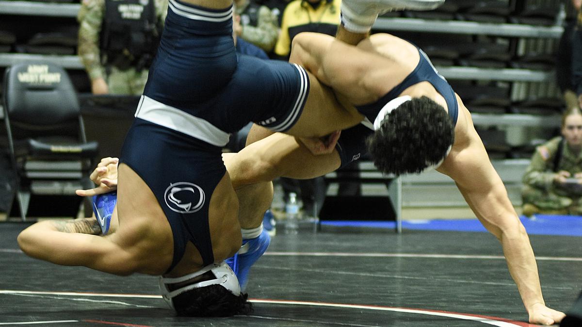 Penn State’s Beau Bartlett, right, and teammate David Evans scramble for a takedown in their 141-pound Black Knight Invite title match on Sunday at West Point, N.Y. Bartlett edged Evans, 3-1, in sudden victory.