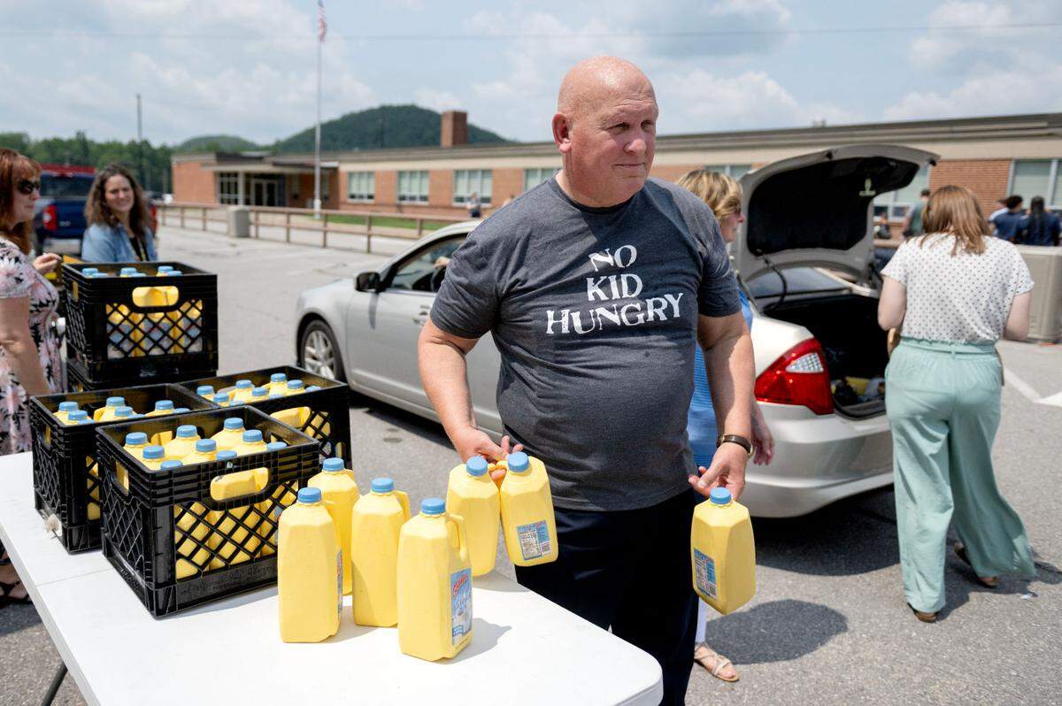 U.S. Rep. Glenn “GT” Thompson helps hand out milk at the Summer Meals Distribution outside of Wingate Elementary School on Monday, Aug. 5, 2024.