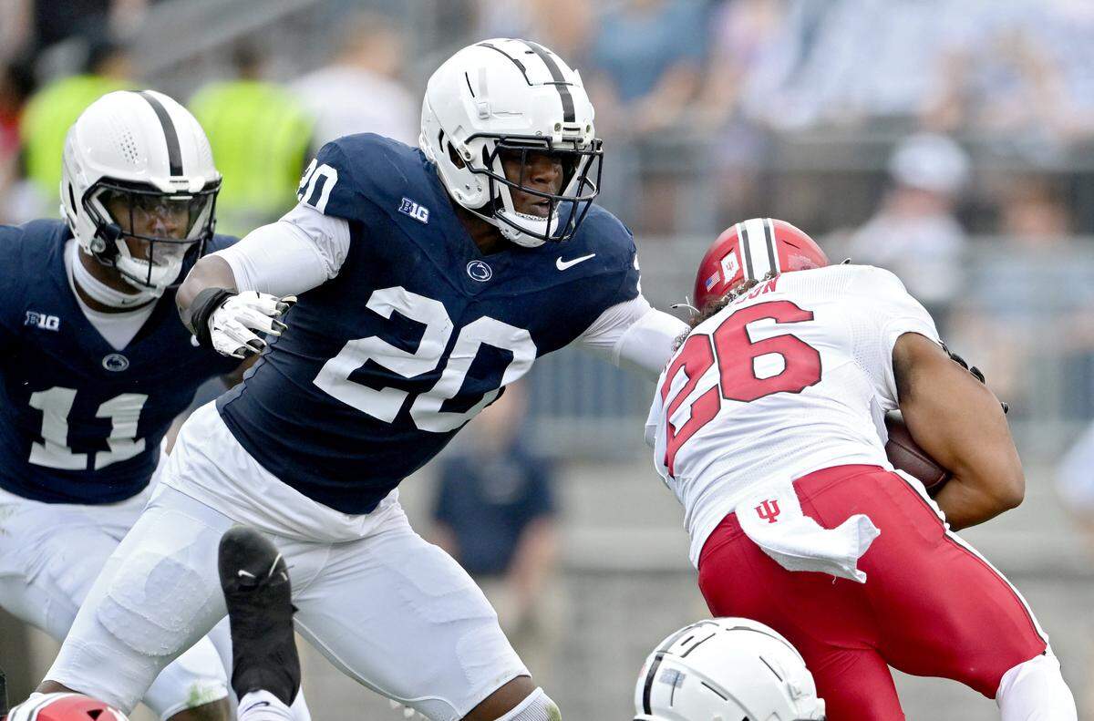 Penn State defensive end Adisa Isaac reaches to stop Indiana’s Josh Henderson during the game Saturday, Oct. 28, 2023.