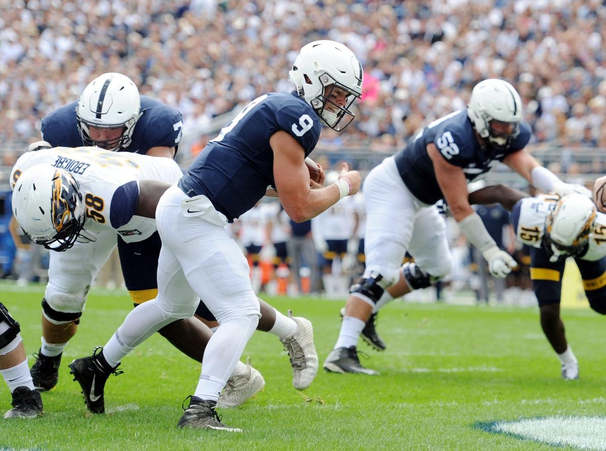 Penn State quarterback Trace McSorley scores a touchdown during a game against Kent State Saturday, Sept. 15, 2018 at Beaver Stadium.