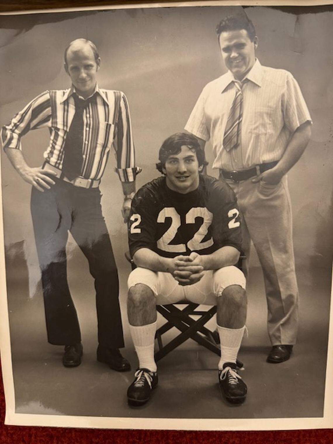 Former Centre Daily Times writers Doug McDonald (right) and Ron Bracken (left) pose with Penn State running back and 1973 Heisman Trophy winner John Cappelletti.