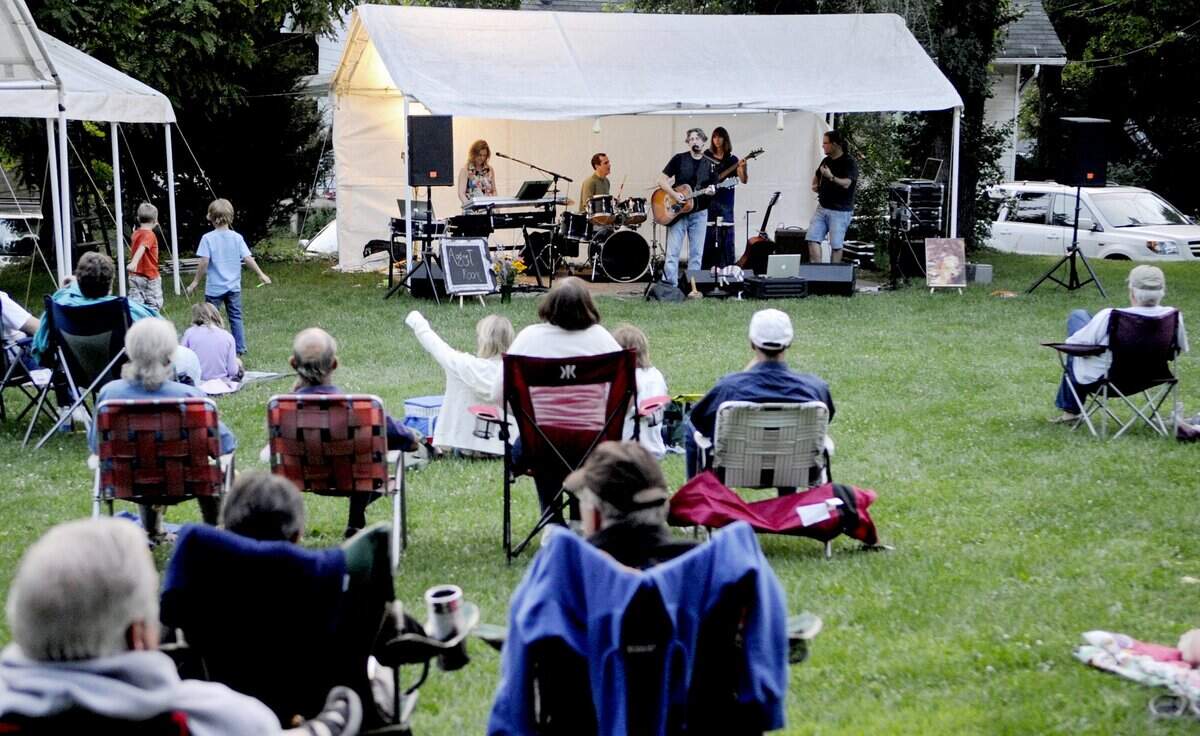 August Room entertains the crowd for the Friday evenings on the Lemont Village Green concert series in 2013.