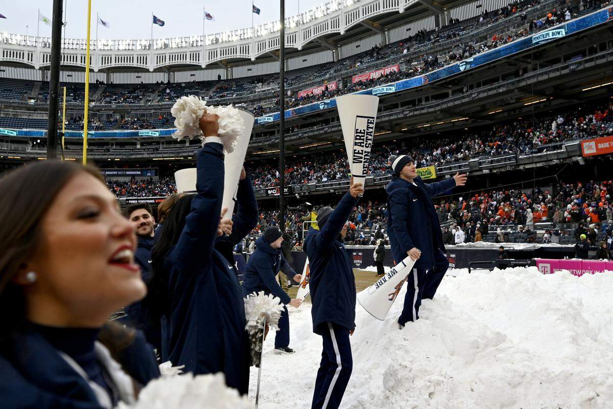 The Penn State cheerleaders pump up the crowd during the Pinstripe Bowl at Yankee Stadium on Saturday, Dec. 27, 2025.  
