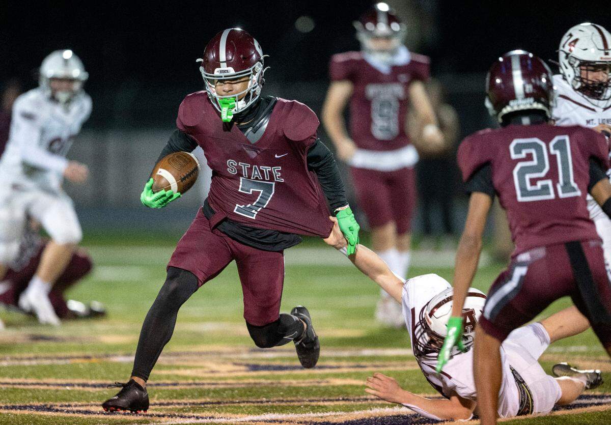 Altoona defenders can’t stop State College’s D’Antae Sheffey during the District 6 6A championship game at Bald Eagle Area on Thursday, Nov. 10, 2022. State College won, 28-7.