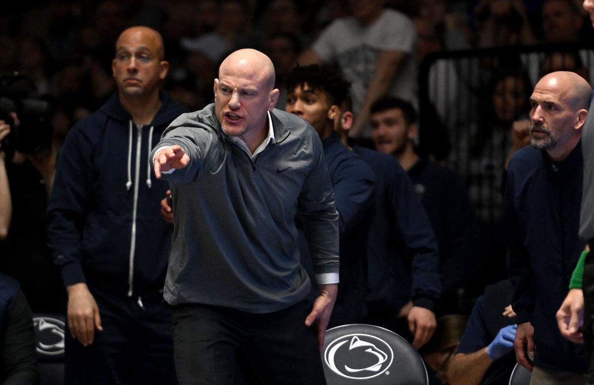 Penn State wrestling coach Cael Sanderson yells to the referee during the match against Nebraska on Sunday, Feb. 18, 2024 in Rec Hall.