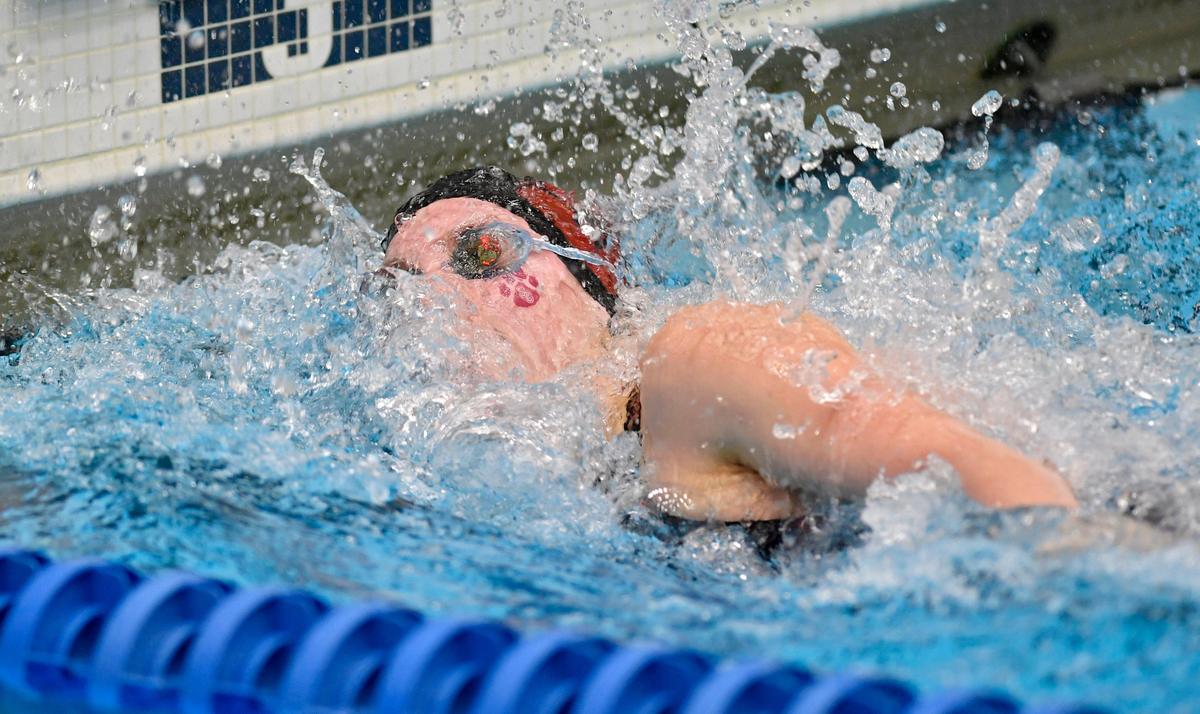 State College’s Abbey Whipple hits the wall to win the girls AAA 50 yard freestyle during the District 6 swimming championships on Friday, Feb. 28, 2020.