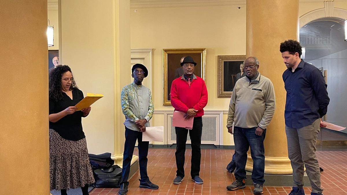 Penn State professors Jennifer Black, Michael West, Gary King, Darryl Thomas and Chris Dancy held a read-in at University Park’s Old Main Monday afternoon.