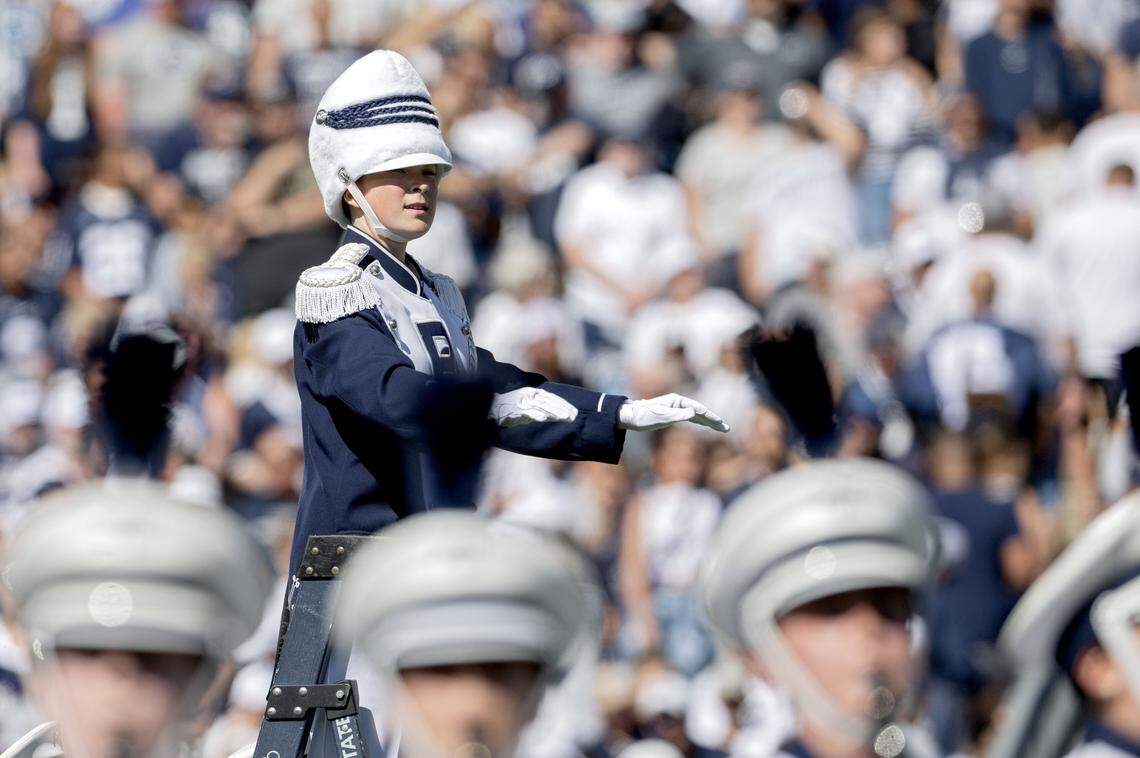 Penn State Blue Band drum major Ellie Sheehan conducts the alma mater in the pregame show on Saturday, Aug. 30, 2025.  