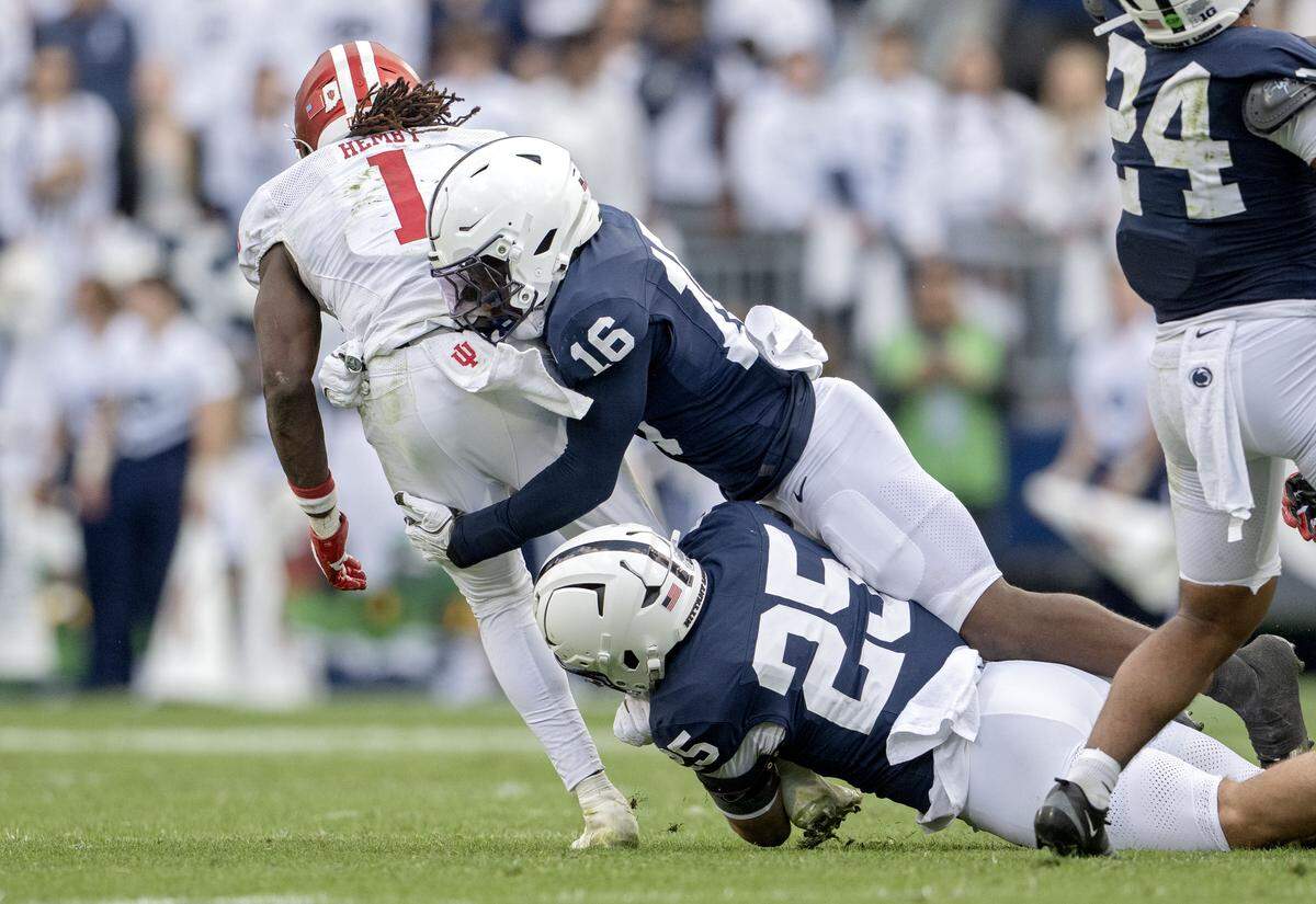 Penn State safety King Mack and linebacker Alex Tatsch stop Indiana running back Roman Hemby during the game on Saturday, Nov. 8, 2025.
