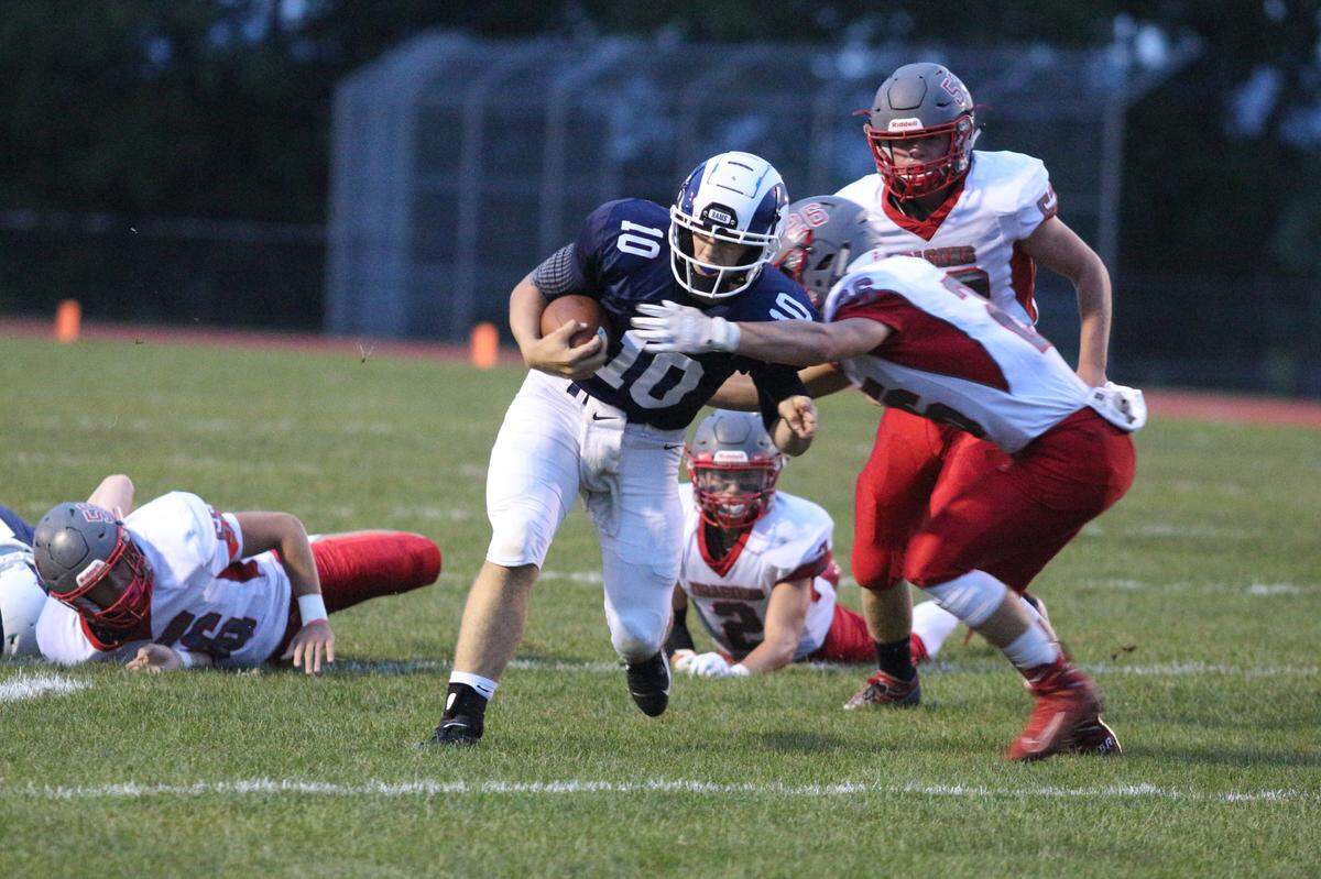 Penns Valley QB Aaron Tobias runs down the field against Central on Friday in Spring Mills.