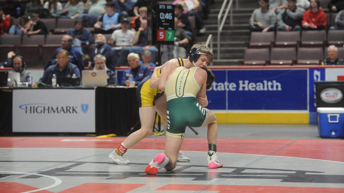Bald Eagle Area’s Coen Bainey controls Wyoming Area’s Jaden Pepe in their 120-pound semifinals match of the PIAA Class 2A Championships on Friday, March 11, 2022 at Giant Center in Herhsey. Pepe beat Bainey, 10-5, to make the finals.