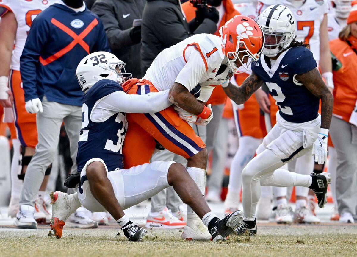 Penn State linebacker Keon Wylie stops Clemson wide receiver T.J. Moore during the Pinstripe Bowl at Yankee Stadium on Saturday, Dec. 27, 2025.  