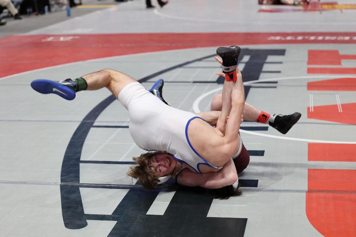 State College’s Asher Cunningham looks to roll over Nazareth’s Jake Doone with a cradle in their 145-pound quarterfinals match of the PIAA Class 3A Championships on Friday, March 10, 2023 at the Giant Center in Hershey. Cunningham beat Doone, 8-2.