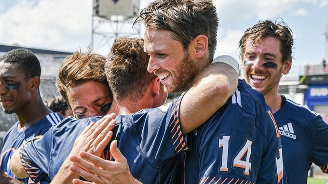 Drew Adams, right, hugs Archers teammate Will Manny.