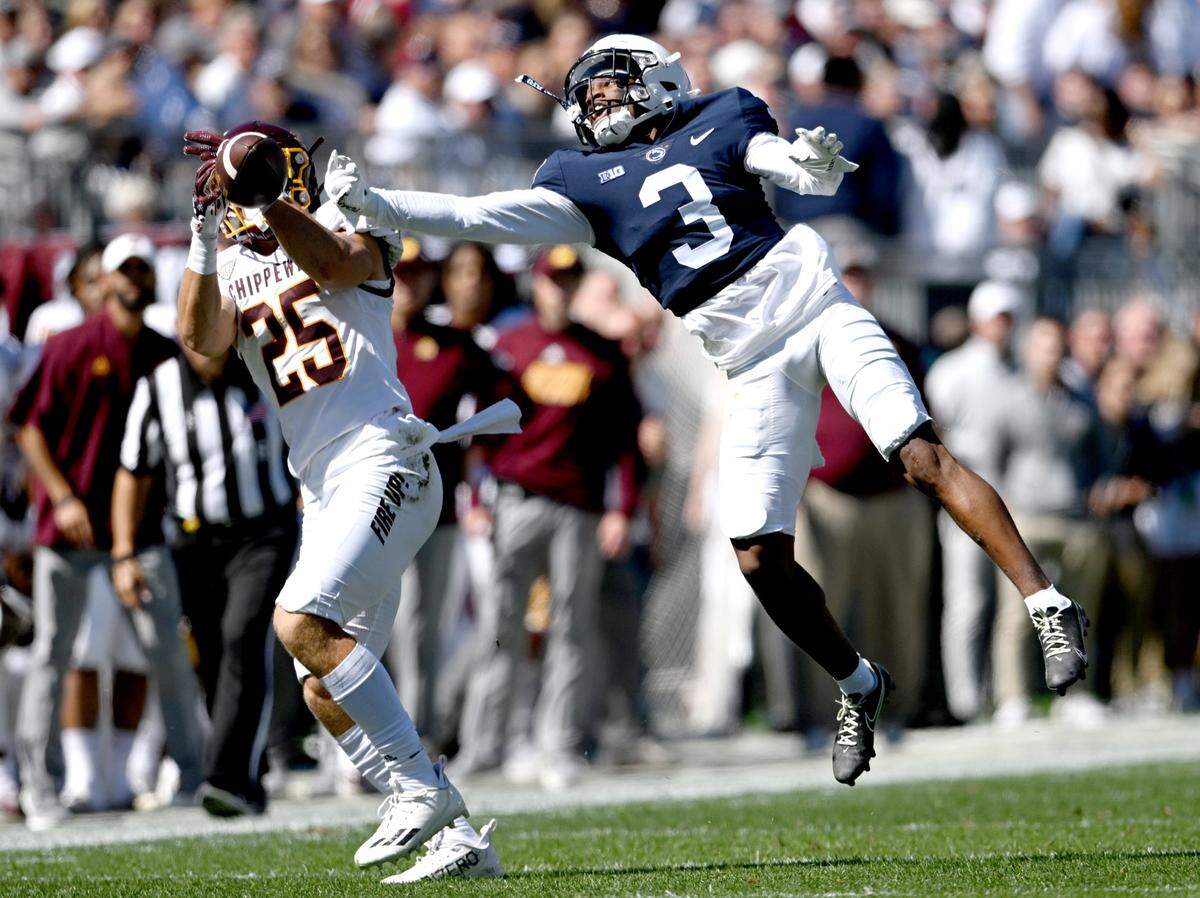 Penn State cornerback Johnny Dixon knocks the ball from Central Michigan’s Noah Koenigsknecht during the game on Saturday, Sept. 24, 2022.