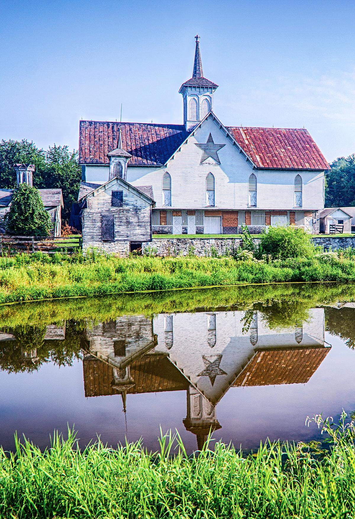R Thomas Berner’s “Star Barn” is on display in the East Rotunda of the State Capitol in Harrisburg as part of a show from the Farmland Preservation Artists of Central Pennsylvania.