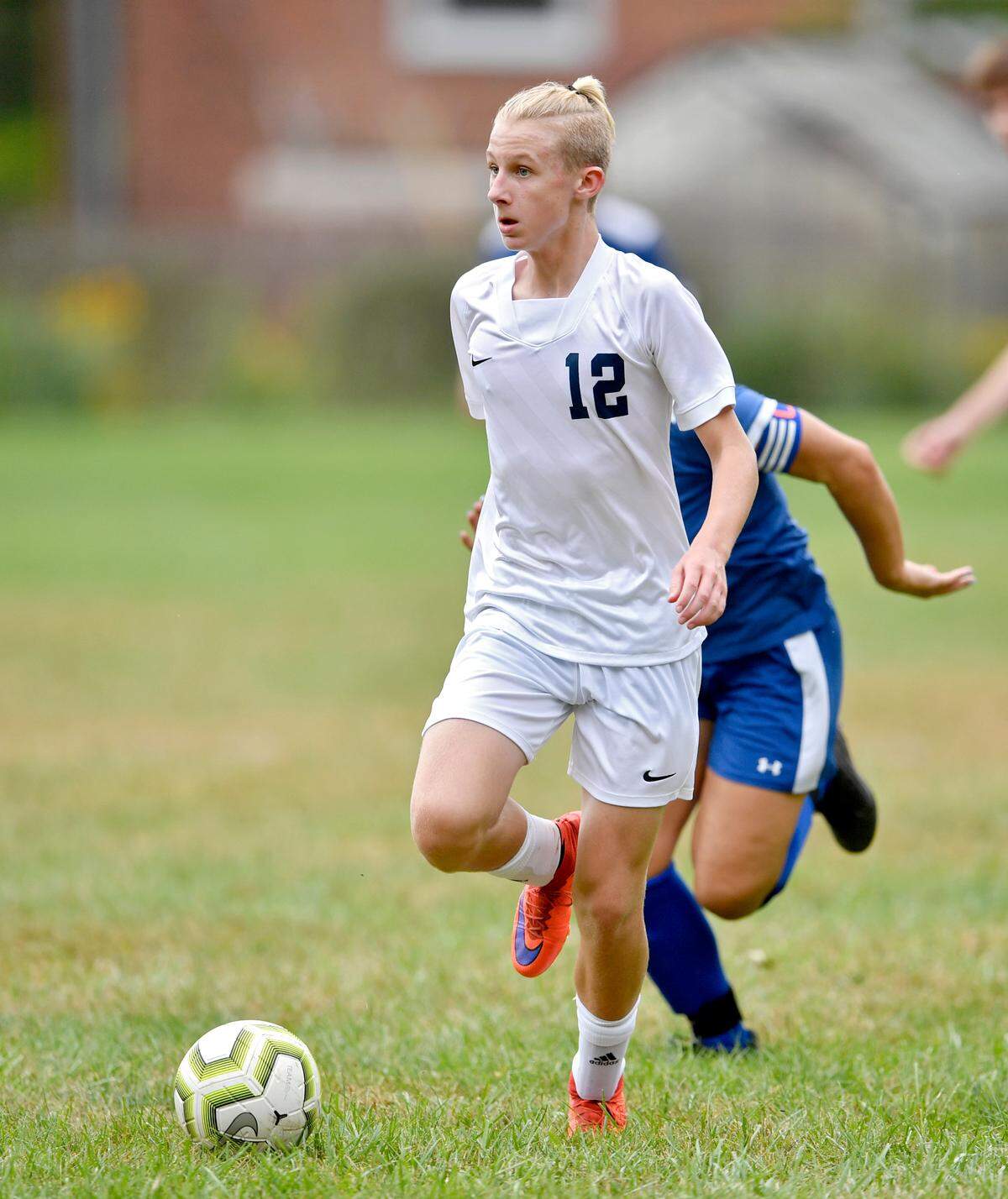 Philipsburg-Osceola’s Carson Long runs down the field with the ball ahead of a Saint Joseph defender during the game on Thursday, Sept. 16, 2021.