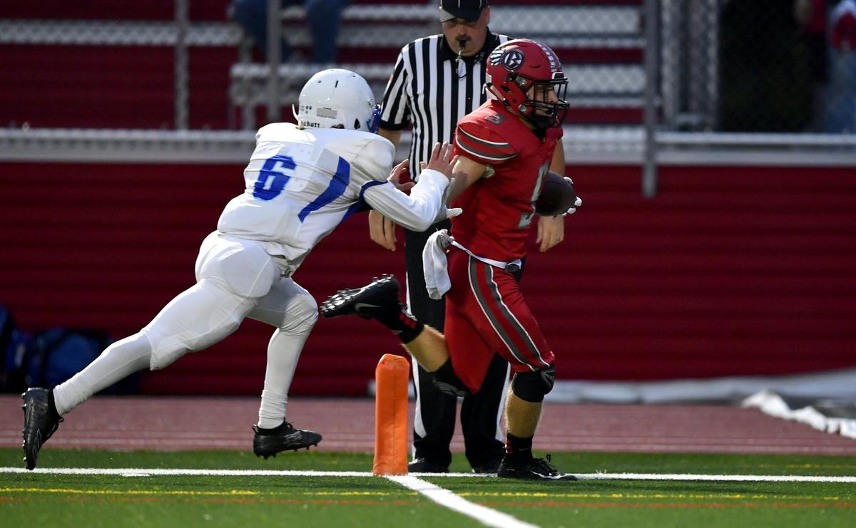 Bellefonte’s Trae Bauman makes a catch and runs it in for a touchdown during the first quarter of the game against Central Mountain on Friday, Sept. 13, 2019.