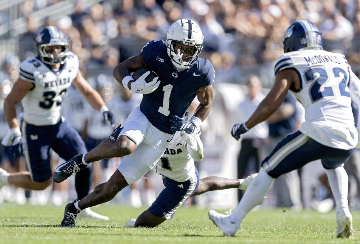 Penn State wide receiver Kyron Hudson makes a catch and cuts past a Nevada defender during the game on Saturday, Aug. 30, 2025 at Beaver Stadium.  