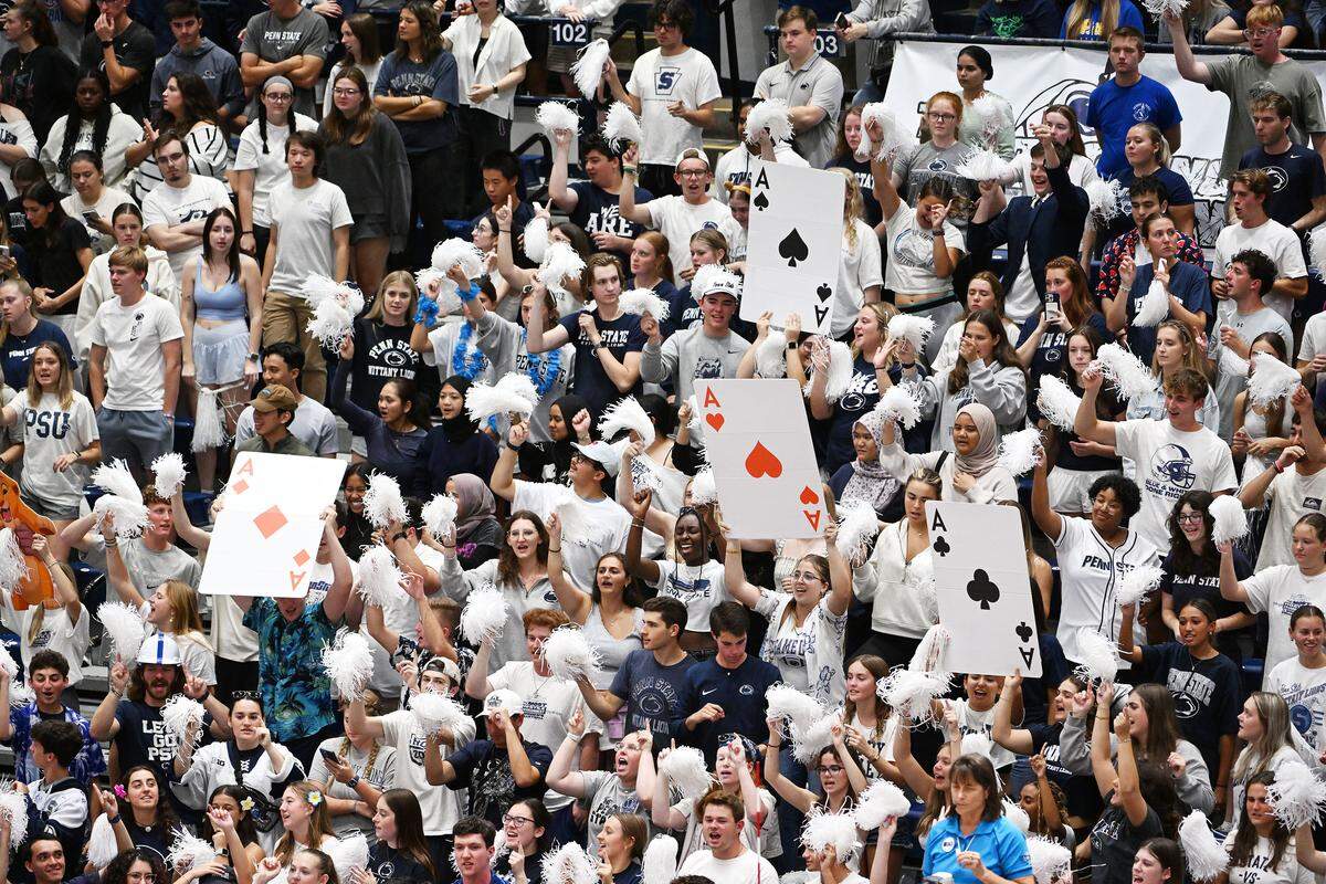 The Penn State student section celebrates a service ace by the Nittany Lions during Wednesday's match against the Pitt Panthers at Rec Hall in State College.