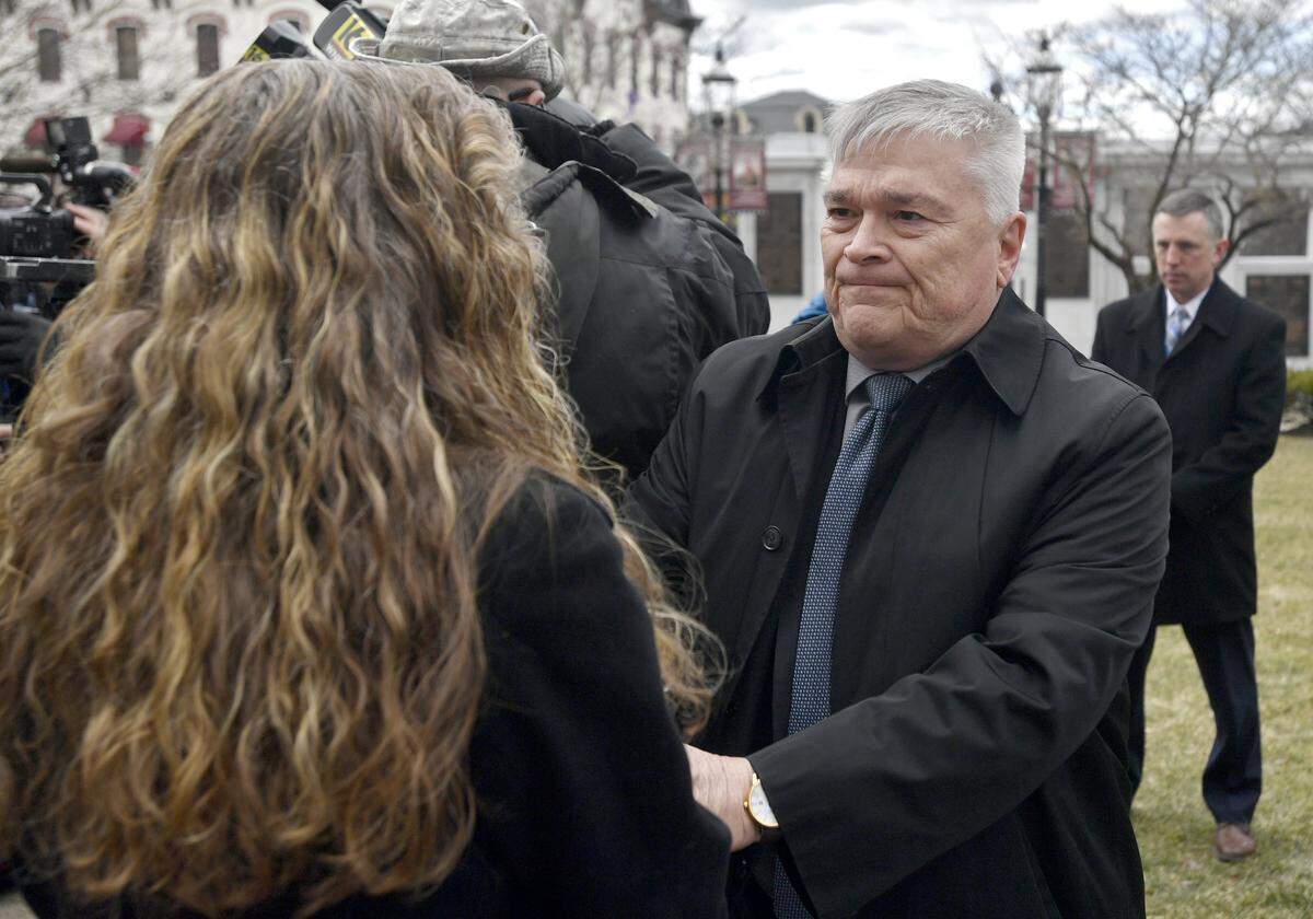 Penn State President Eric Barron shakes hands with Evelyn Piazza in March after the anti-hazing legislation named after her late son, Timothy Piazza, was introduced outside of the Centre County Courthouse.