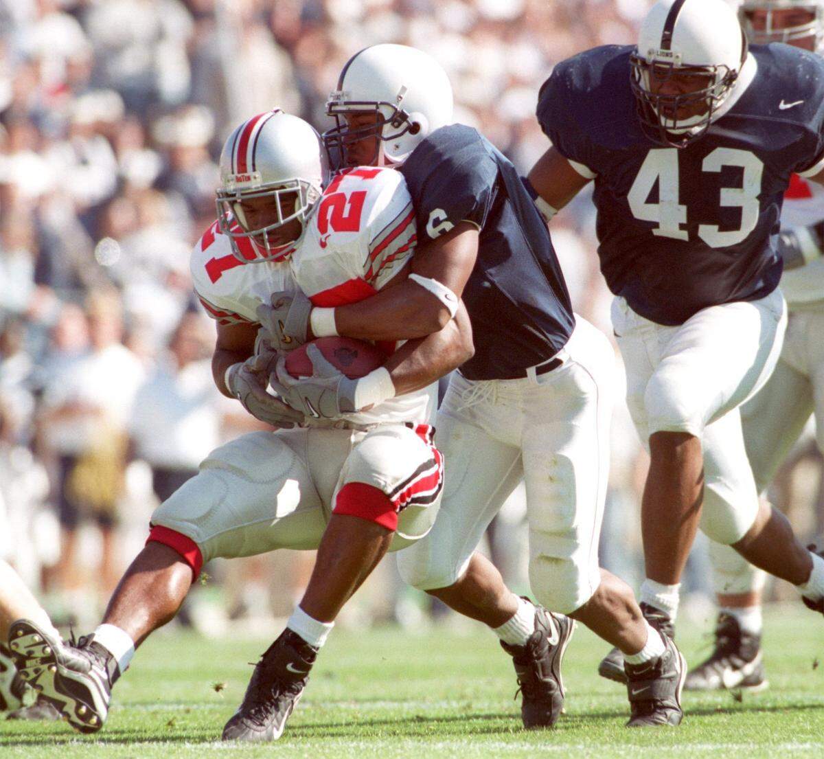 Penn State’s James Boyd takes down Ohio State’s Jerry Westbrooks during the second quarter of the game at Beaver Stadium on Oct. 16,1999.