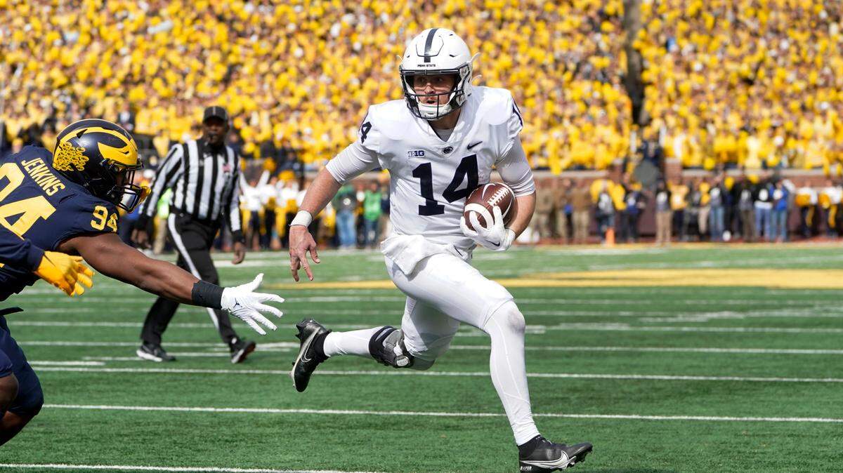 Penn State quarterback Sean Clifford (14) runs against Michigan in the first half of an NCAA college football game in Ann Arbor, Mich., Saturday, Oct. 15, 2022.