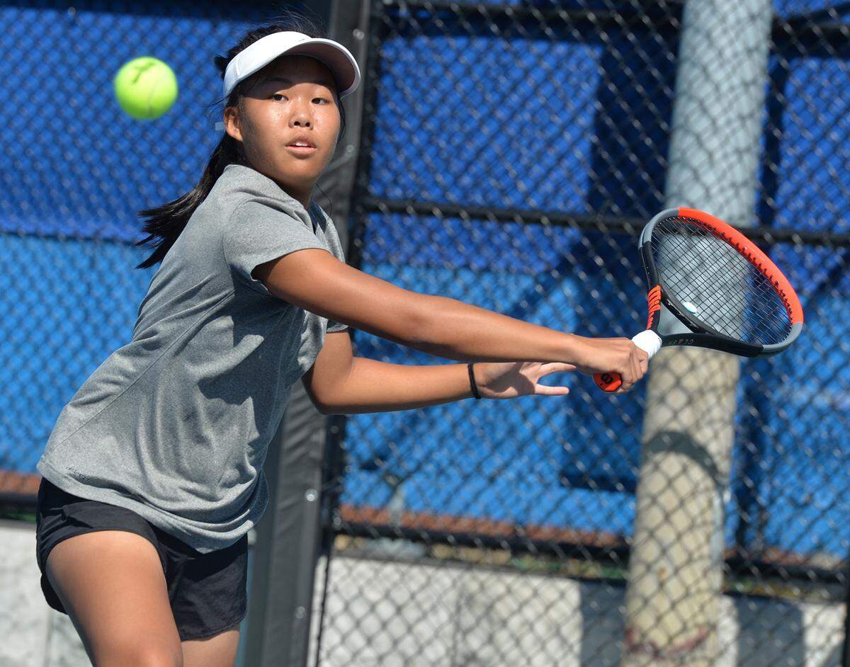 09/29/21 By Gary M. Baranec   State College High School’s Quiana Guo competes against Hollidaysburg’s Gretta Rhodes for the District 6 AAA Singles championship Wednesday, Sept. 21, 2021 at Altoona Area High School’s Mansion Park courts.