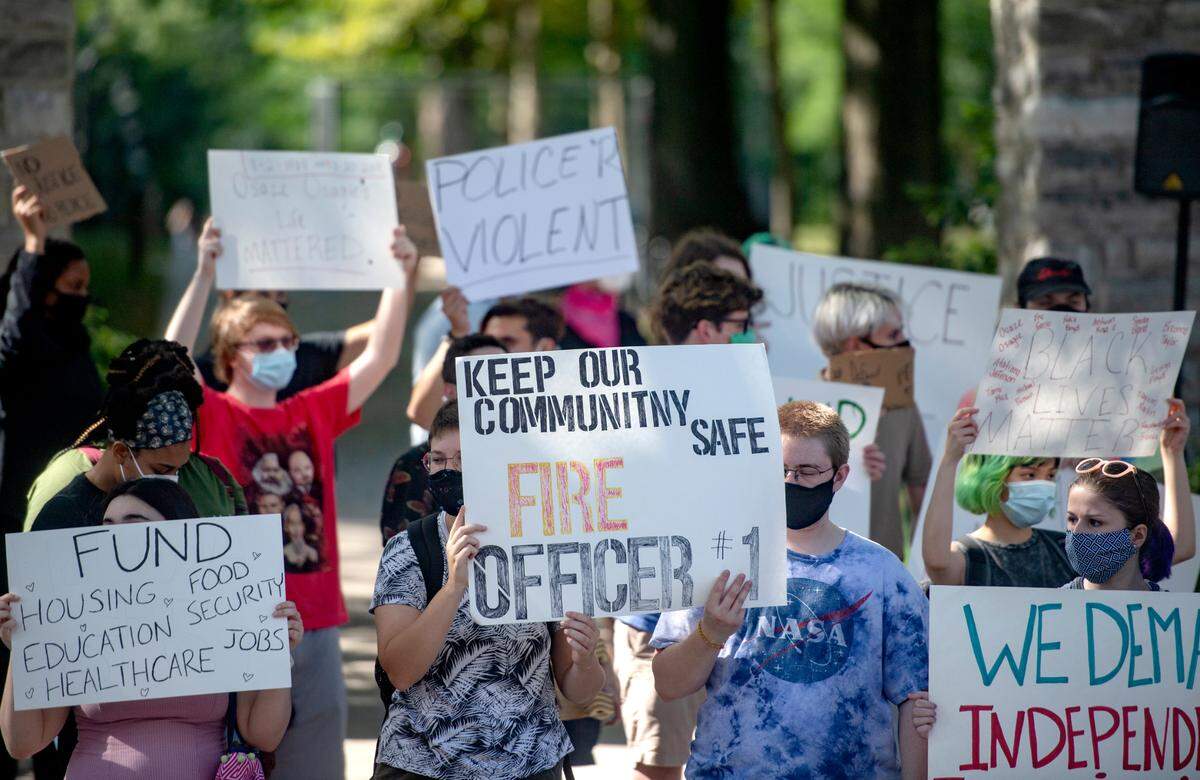 A crowd gathers at the Allen Street gates for the march and teach in organized by the 3/20 Coalition on Saturday, Aug. 29, 2020.