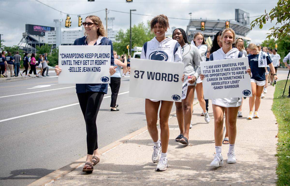 Penn State women athletes lead the “Roar and Rally” walk through campus to celebrate the 50th Anniversary of Title IX on Thursday, June 23, 2022.