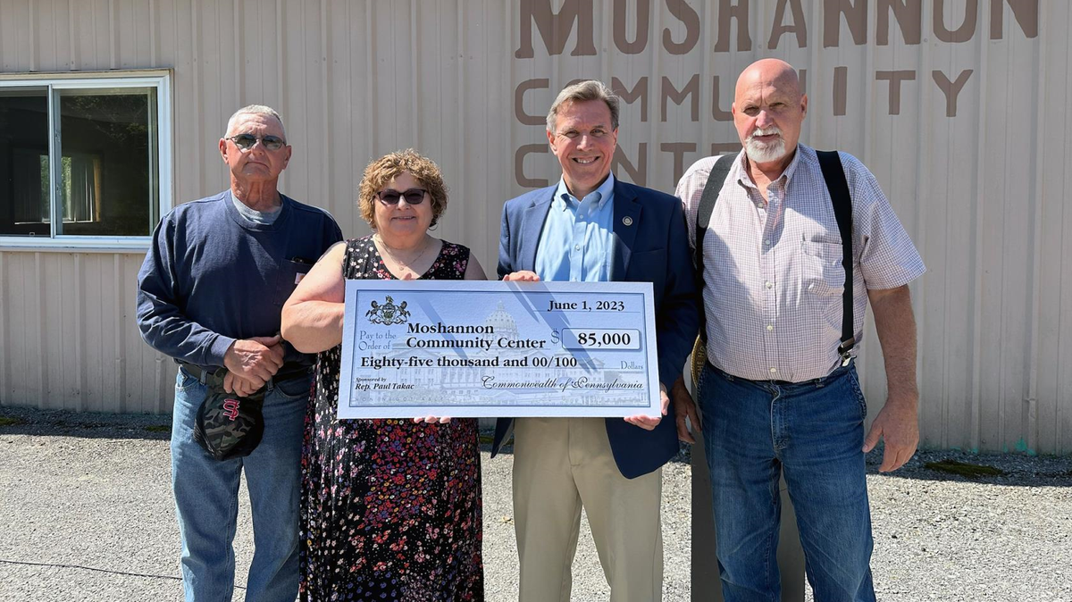John Yecina Jr., Snow Shoe Township Supervisor, Beth Watson, treasurer of the Moshannon Community Center, Rep. Paul Takac and Rodney Preslovich, Snow Shoe Township Supervisor, stand in front of the Moshannon Community Center in Snow Shoe, which received $85,000 in state funding for upgrades.