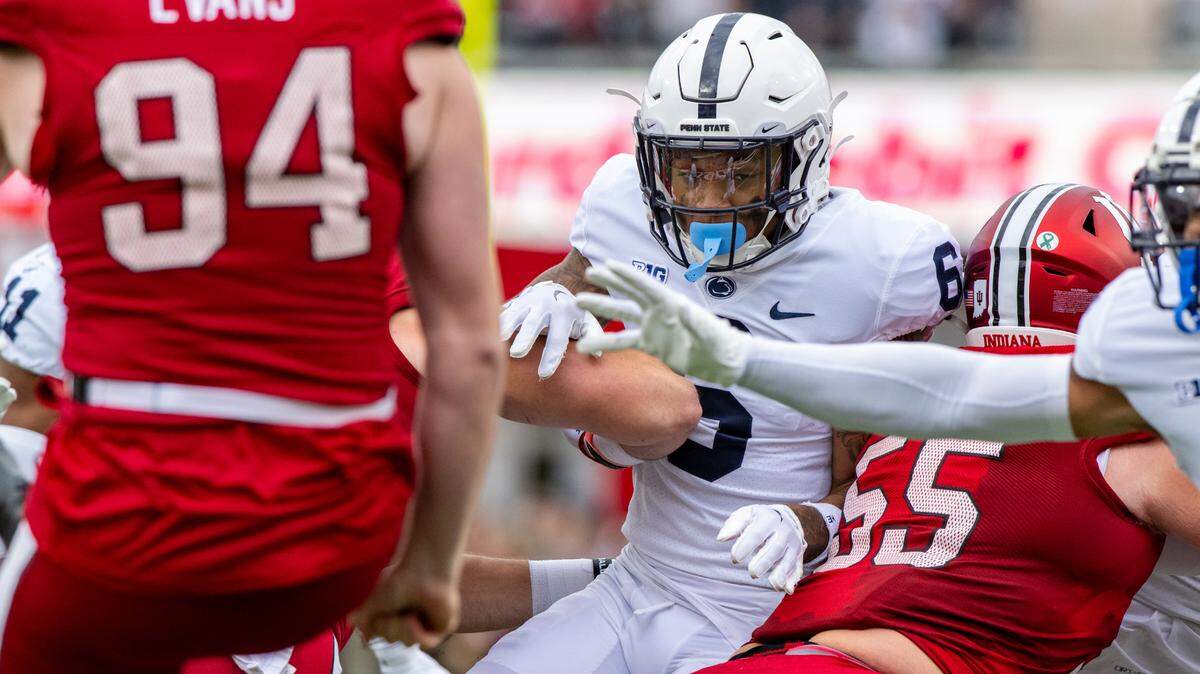 Penn State safety Zakee Wheatley (6) attempts to block a punt by Indiana’s James Evans (94) during Saturday’s game.