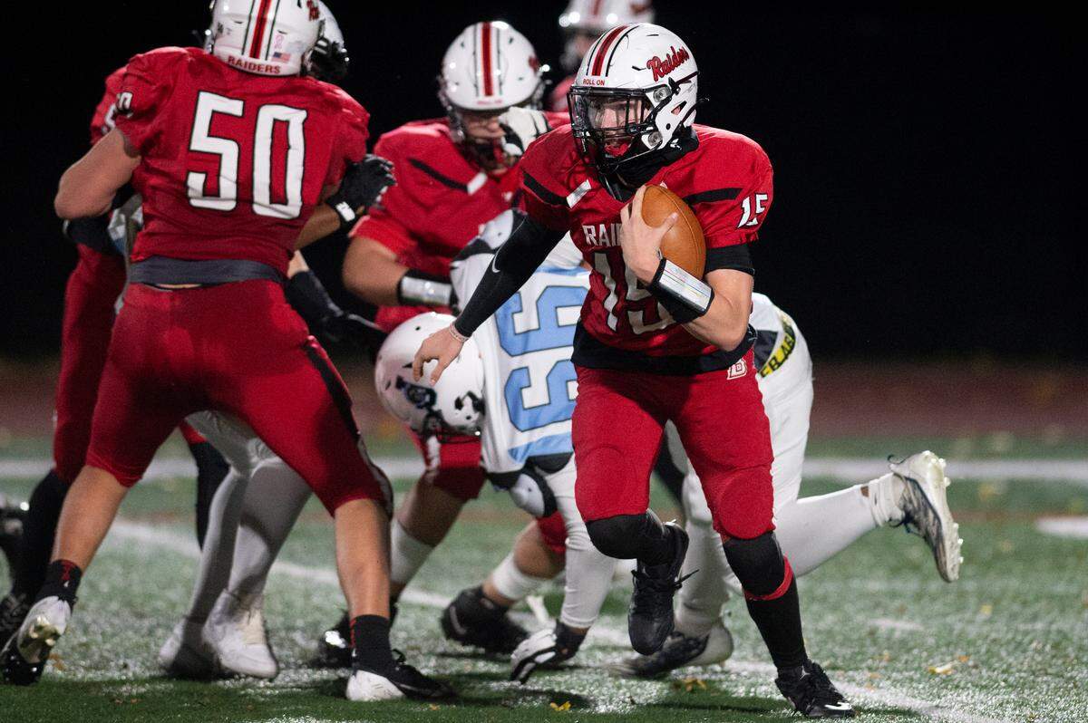Bellefonte quarterback Liam Halterman evades pressure during a football game at Bellefonte High School on Friday, Nov. 1, 2024.