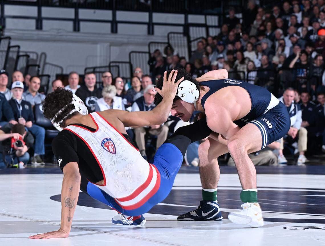 Penn State’s Beau Bartlett takes down American’s Elijah White at 141 lbs during the Friday, Feb. 21, 2025 match at Rec. Hall in State College. Bartlett defeated White by tech fall. Penn State defeated American University, 50-3.