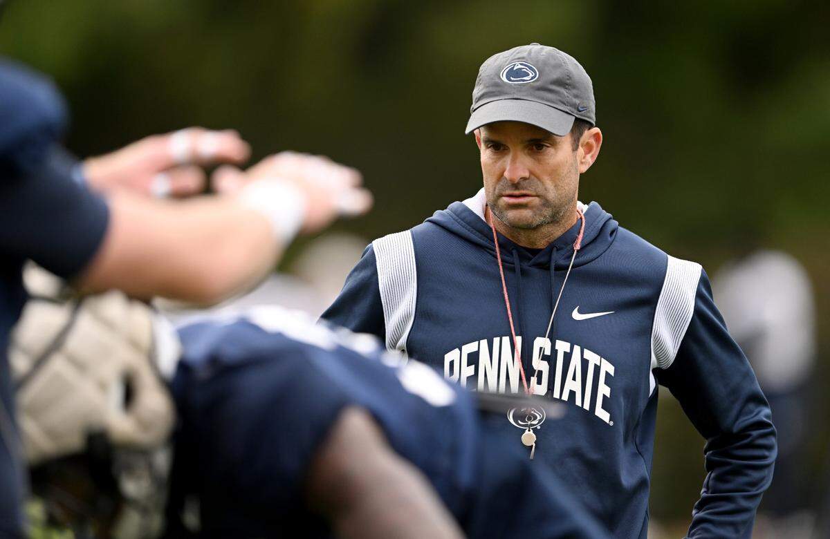 Penn State defensive coordinator Manny Diaz watches players run a tackling drill during practice on Wednesday, Oct. 18, 2023.