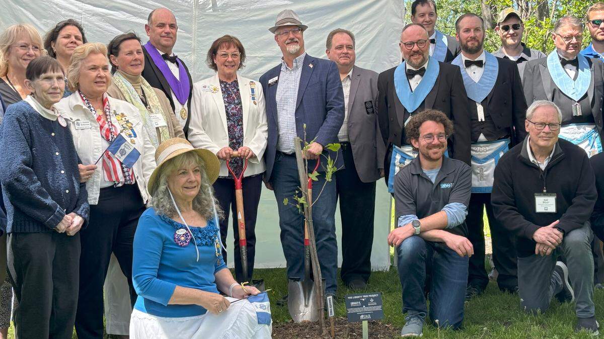 A sapling taken from the clone of a historic Liberty Tree, where American revolutionaries once met, was planted Saturday afternoon on the grounds of Centre Furnace Mansion in State College ahead of America’s 250th birthday next year. Those involved in the project pose in front of the sapling while many partner organizations and individuals took photos.