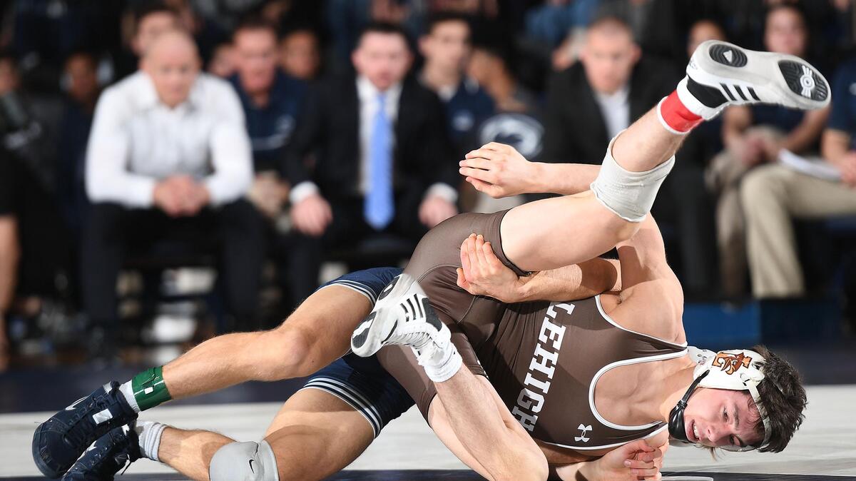 Penn State’s Devin Schnupp, 125 lbs, takes down Lehigh’s  Luke Resnick Sunday at Rec Hall in State College. Schnupp won, 6-1. Penn State defeated Lehigh, 42-0. (For the CDT/Steve Manuel)