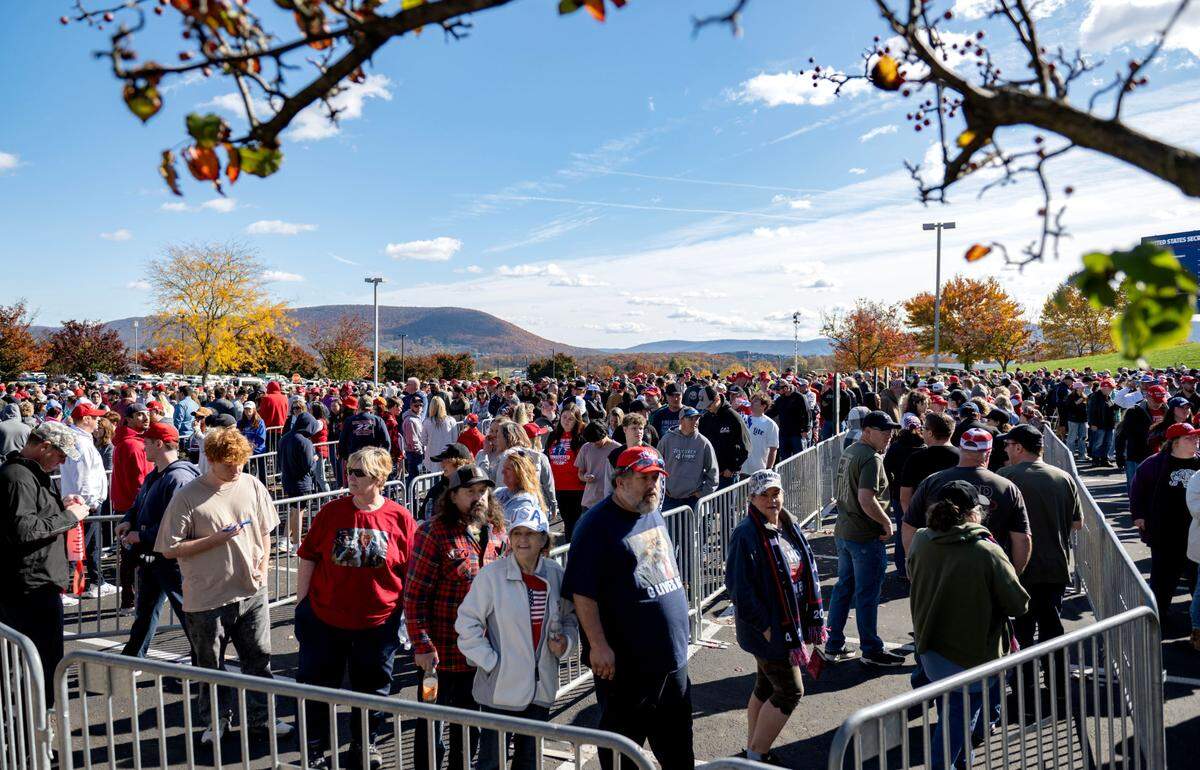 Trump supporters line up to enter the Bryce Jordan Center for a rally on Saturday, Oct. 26, 2024.
