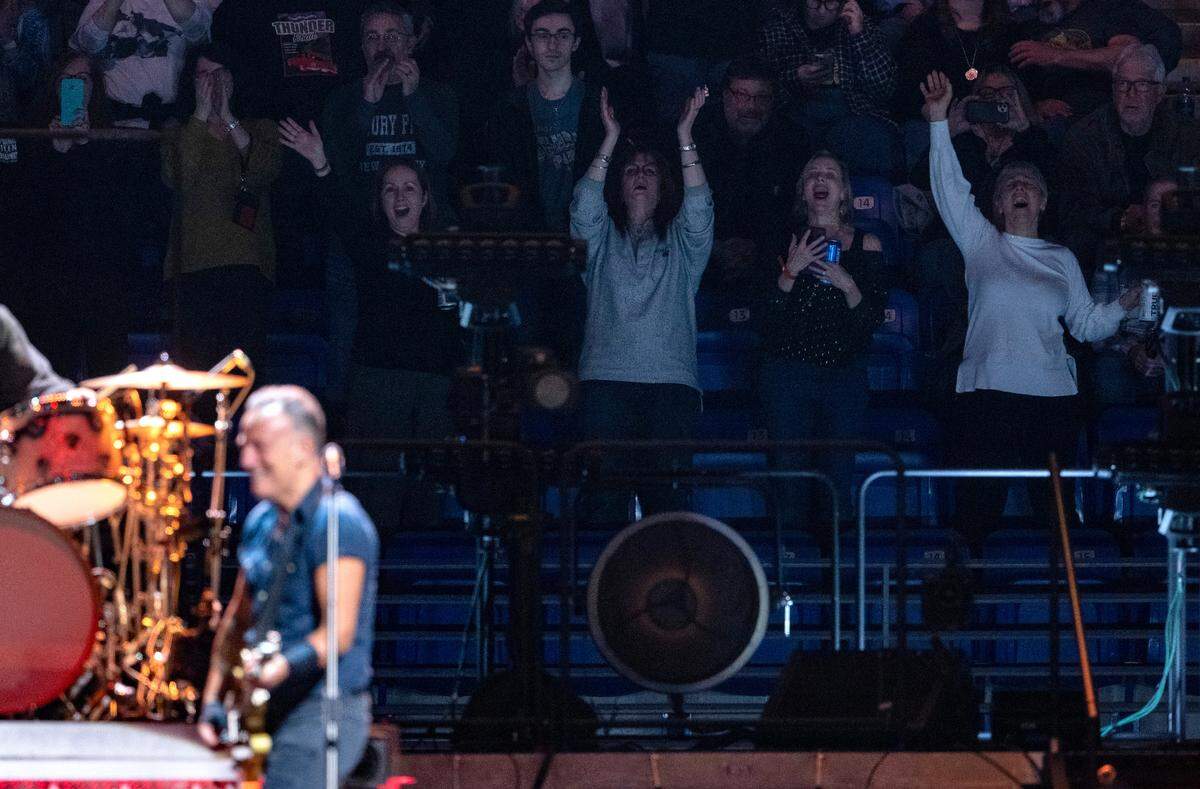 Fans sing along and cheer for Bruce Springsteen and the E Street Band during the show at the Bryce Jordan Center on Saturday, March 18, 2023.