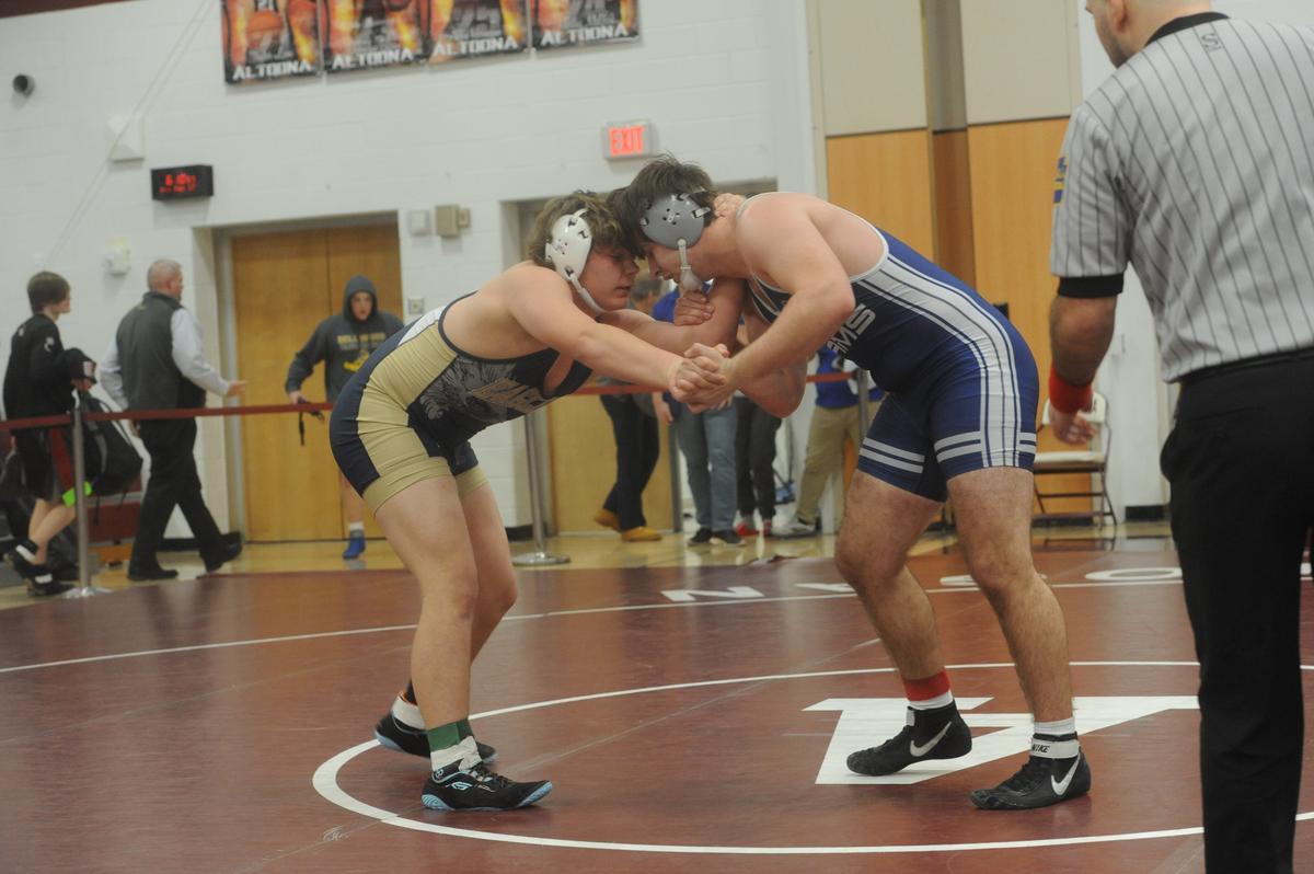 Bald Eagle Area’s Gage Gardner and Penns Valley’s Kollin Brungart look for an opening to score in their 215-pound quarterfinals match of the District 6 Class 2A Championships on Friday, Feb. 17, 2023 in Altoona. Brungart pinned Gardner in the second ultimate tiebreaker in 7:45.