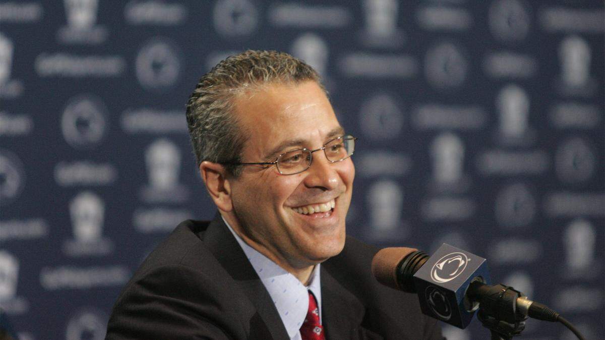 Dr. Wayne Sebastianelli laughs at a question during a weekly football news conference at Beaver Stadium in 2002.