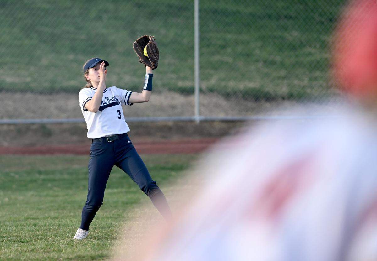 Penns Valley’s Clara Brooks catches a fly ball in right field and throws it home for an out during the game against Bellefonte on Tuesday, April 4, 2023.