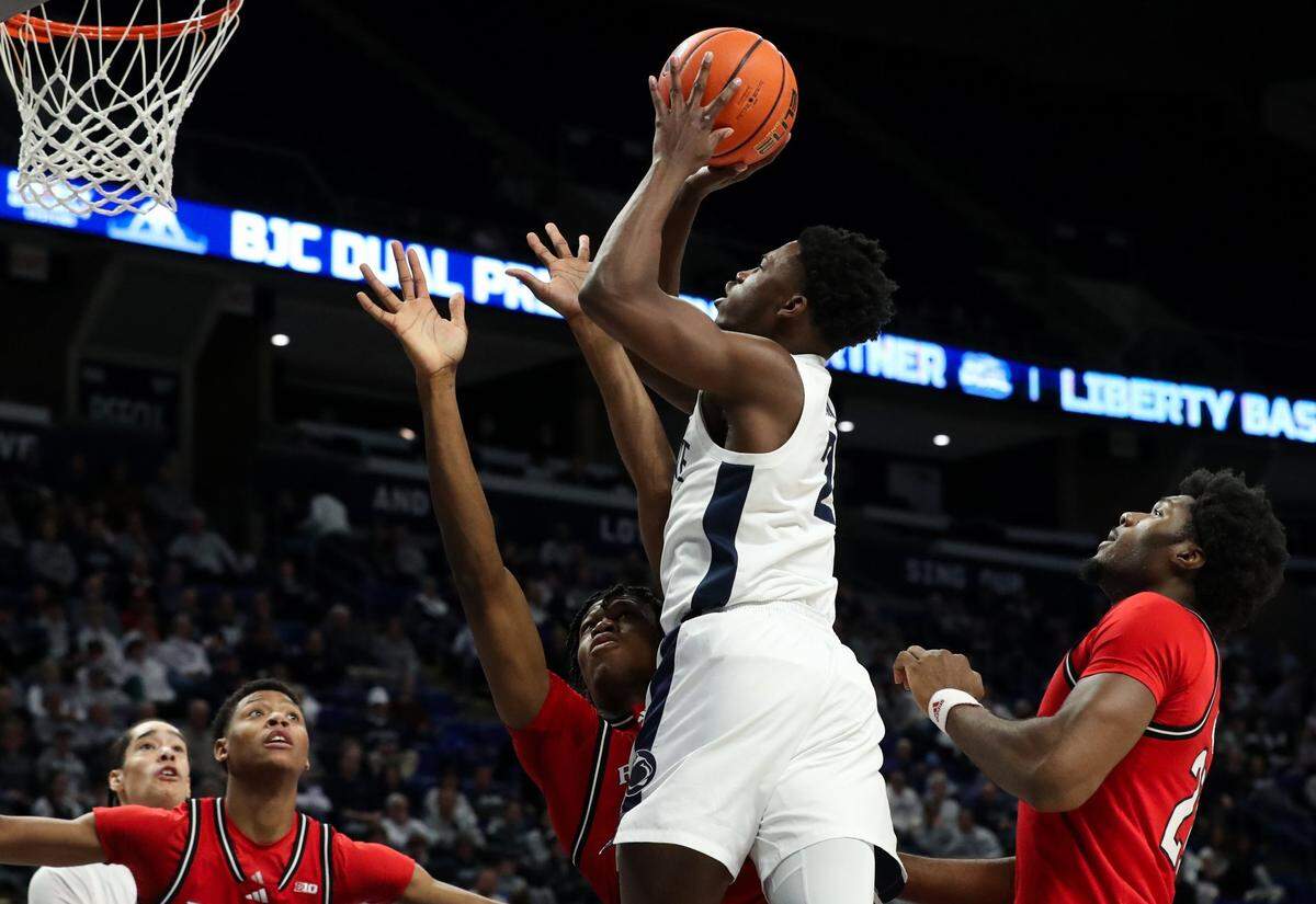 Jan 20, 2025; University Park, Pennsylvania, USA; Penn State Nittany Lions guard D'Marco Dunn (2) drives the ball to the basket as Rutgers Scarlet Knights forward Dylan Grant (9) defends during the first half at Bryce Jordan Center. Mandatory Credit: Matthew O'Haren-Imagn Images