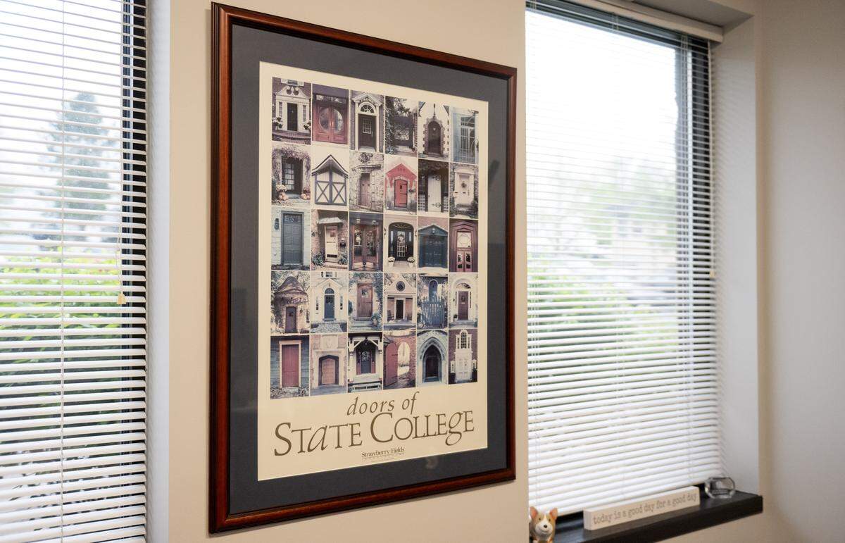 A poster hangs in Strawberry Fields Inc. CEO Cindy Pasquinelli’s office. The poster was a fundraiser for Strawberry Fields in 1998. 