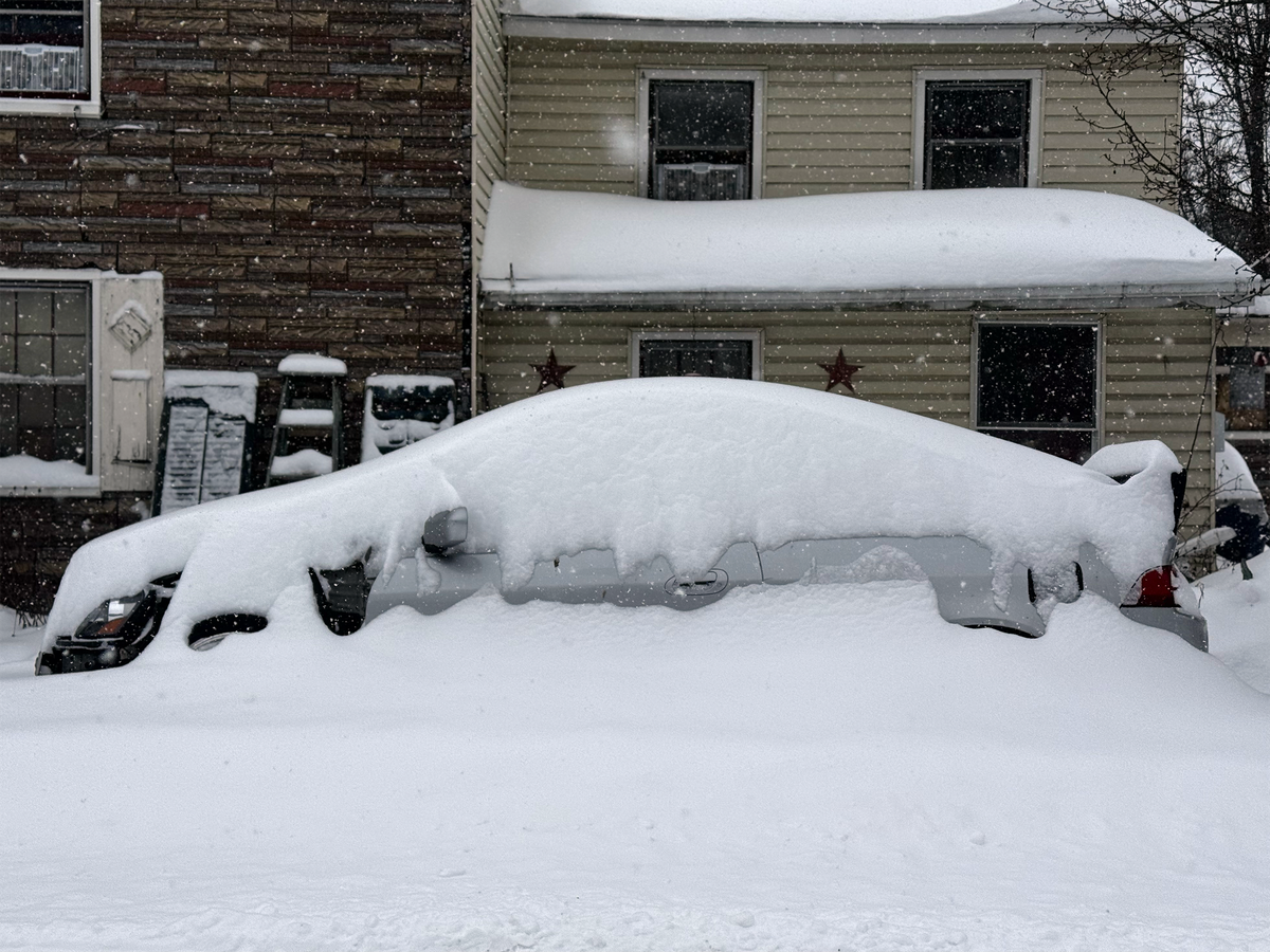 An Acura coupe parked along South Second Street in Philipsburg collects snow on Sunday.