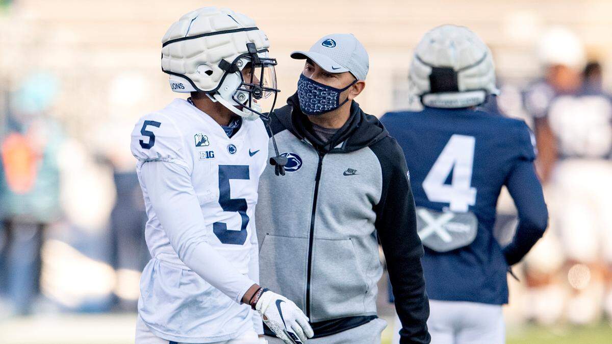 Penn State wide receivers coach Taylor Stubblefield talks with Jahan Dotson during warm ups for Penn State football practice on Friday, April 23, 2021 at Beaver Stadium.
