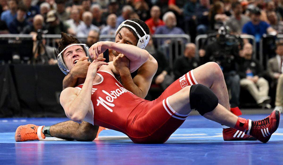 Penn State's Shayne Van Ness controls Nebraska’s Chance Lamer in a 149-pound semifinal bout of the NCAA wrestling championships on Friday, March 20, 2026.