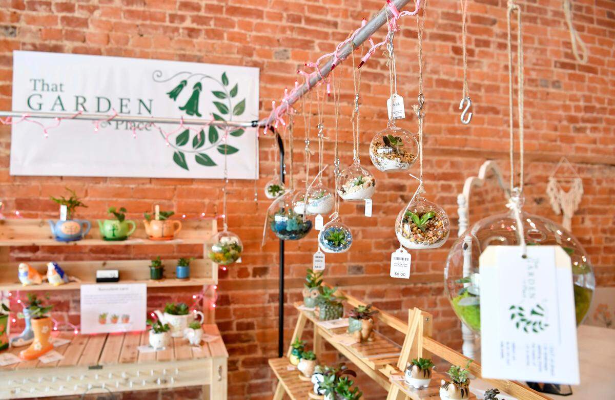 Succulent globes hang in The Garden Place’s booth at Belle Mercantile.