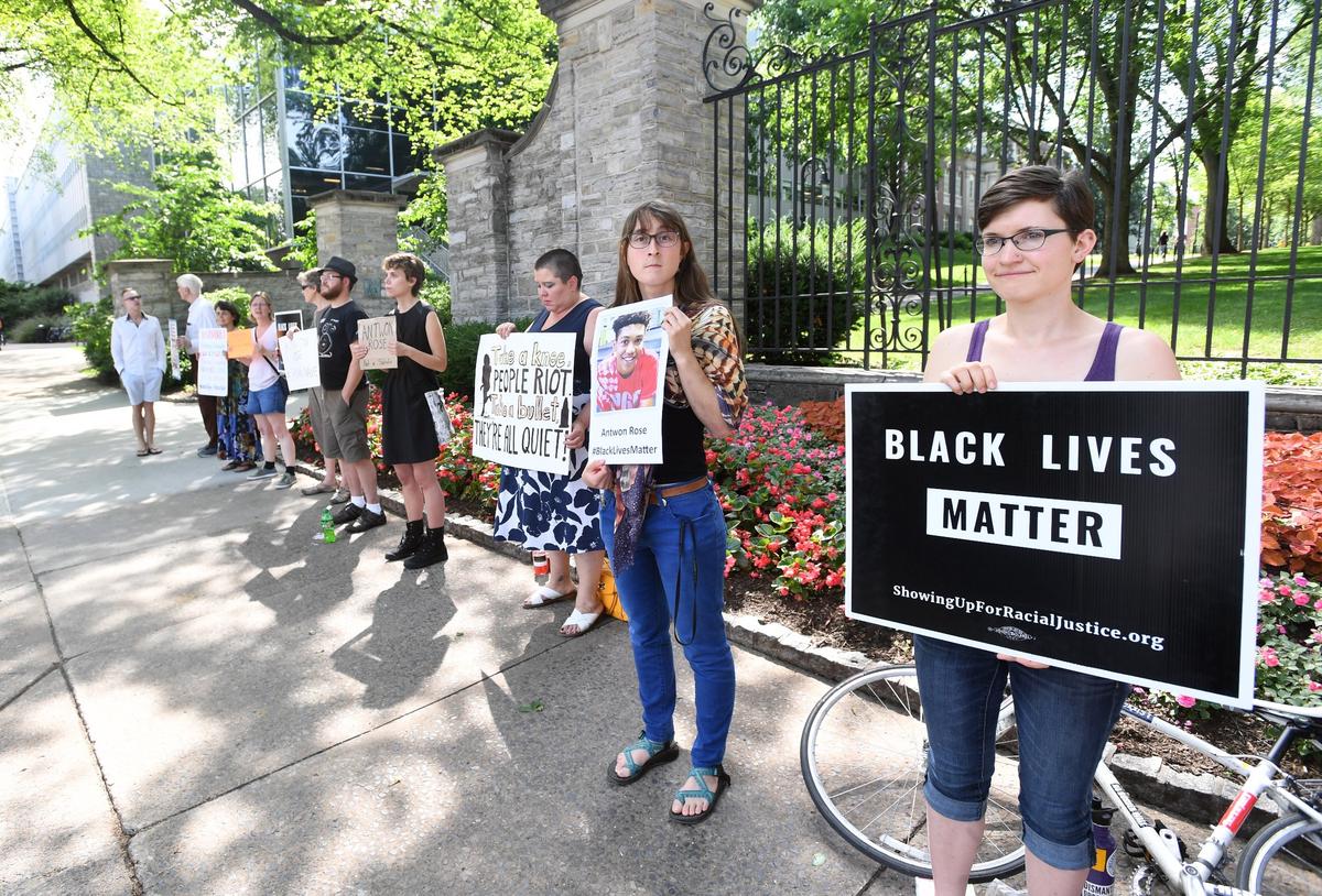 People attend a demonstration for Antwon Rose in June 2018 in front of the Allen Street Gates in State College.
