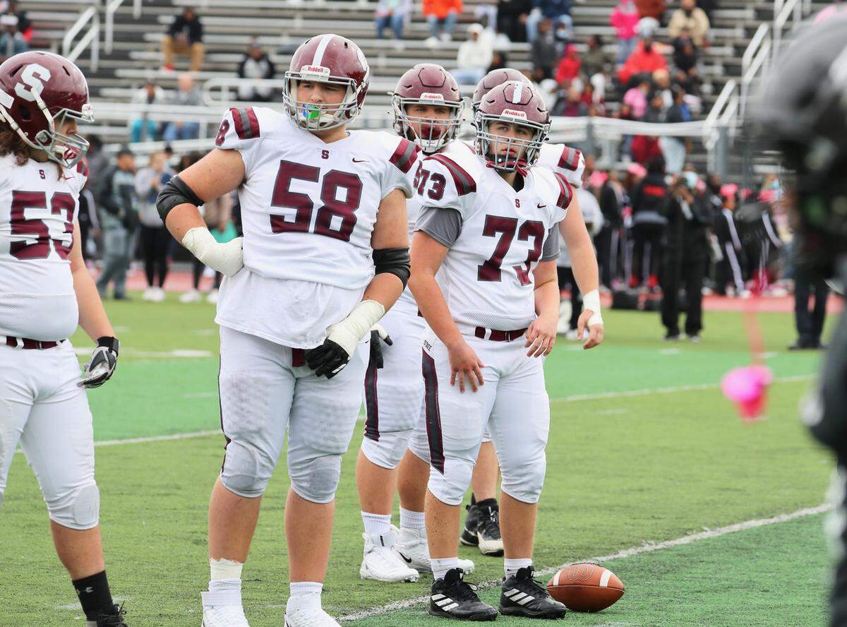 State College offensive linemen Logan Milito (73), Thomas Dincher (58) and John Brighton (53) line up against Harrisburg on Saturday, Oct. 23, 2021.